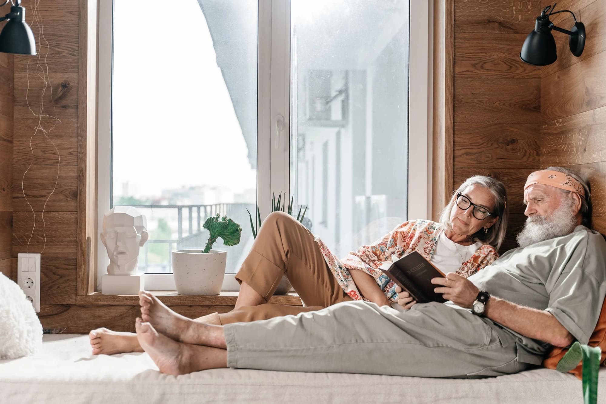 A senior couple reading together on a warm afternoon.